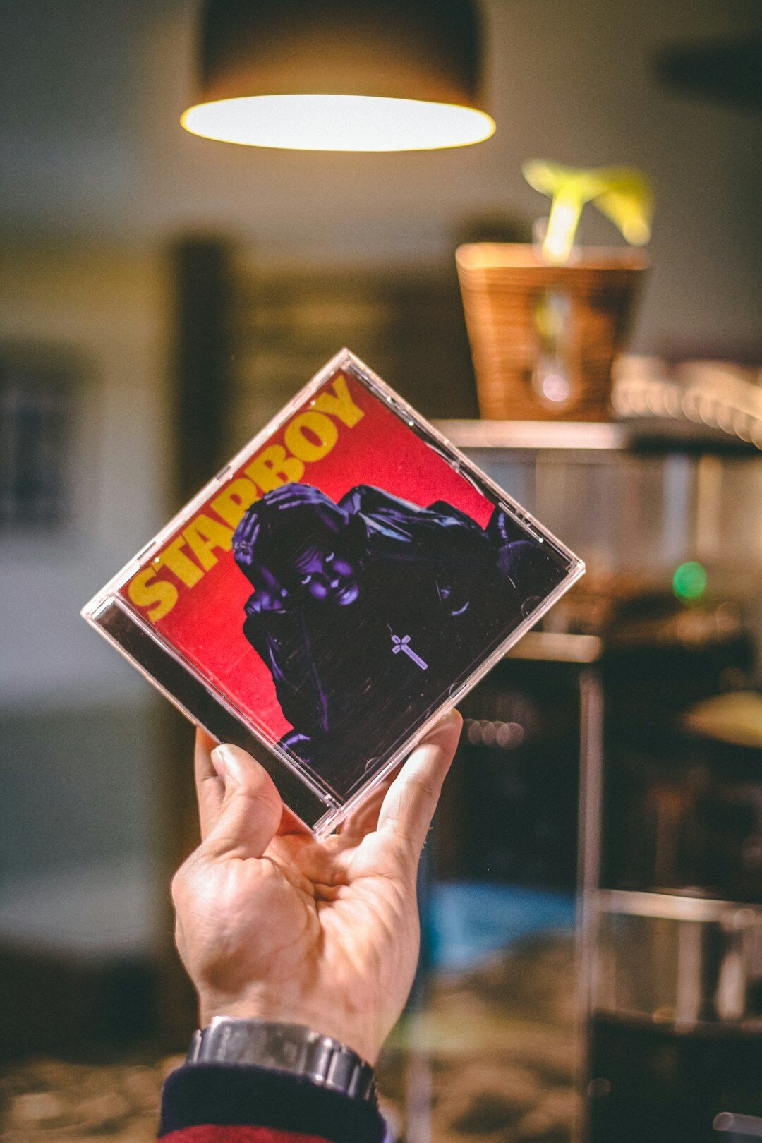 singer holding new album